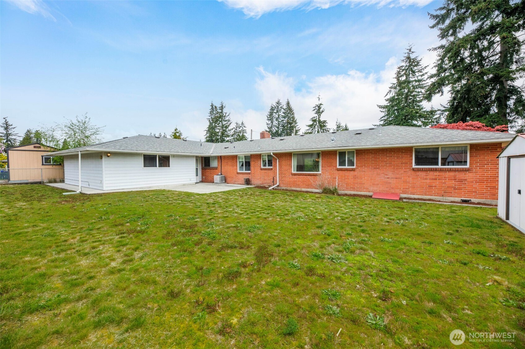 7304 Beverly Boulevard Everett, WA 98203 - Photo 31 of 38 a front view of house with yard and lake