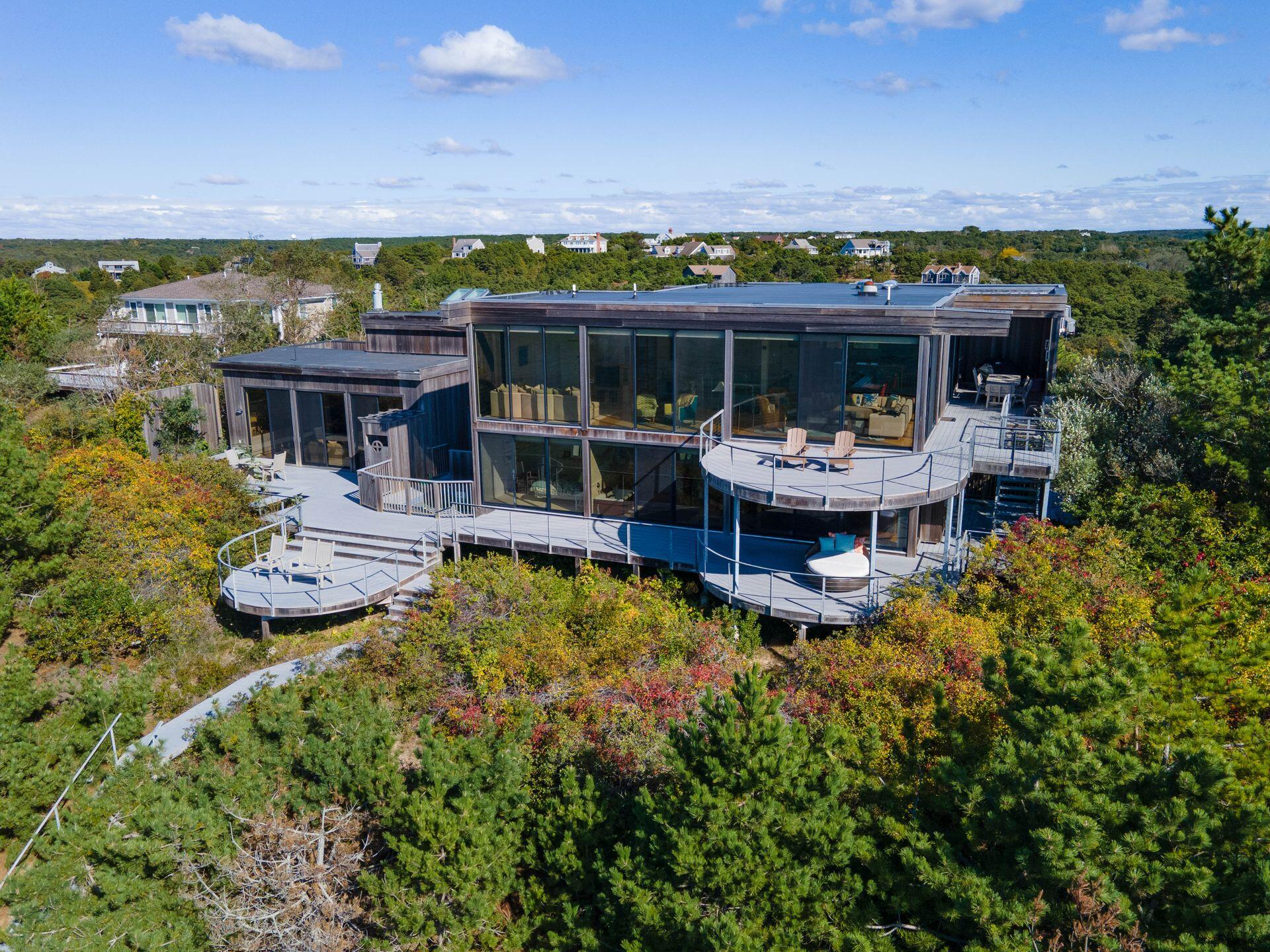 a front view of house with a garden and patio