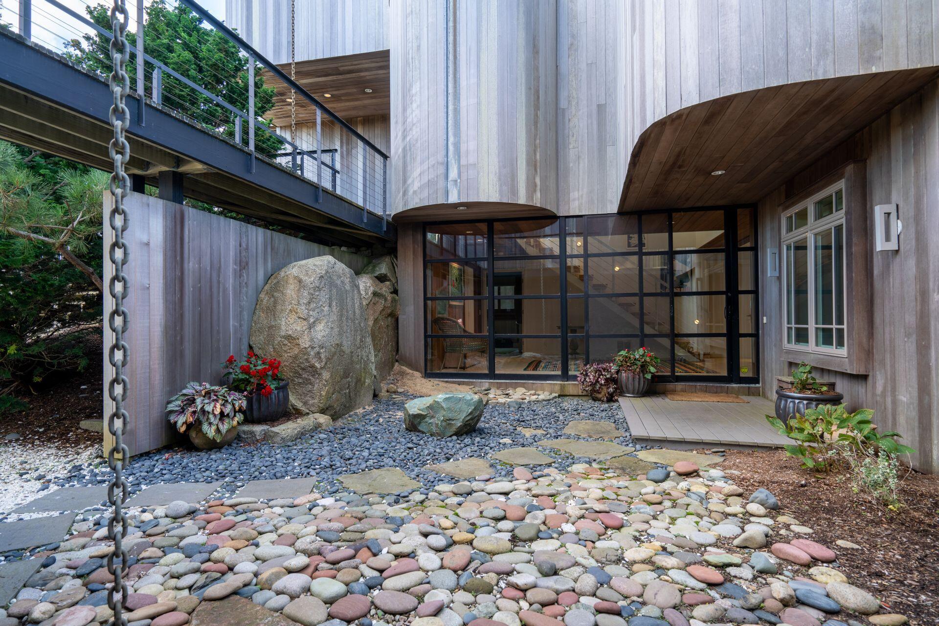 6 Payomet Lane Truro, MA 02666 - Photo 15 of 52 a front view of a house with garden