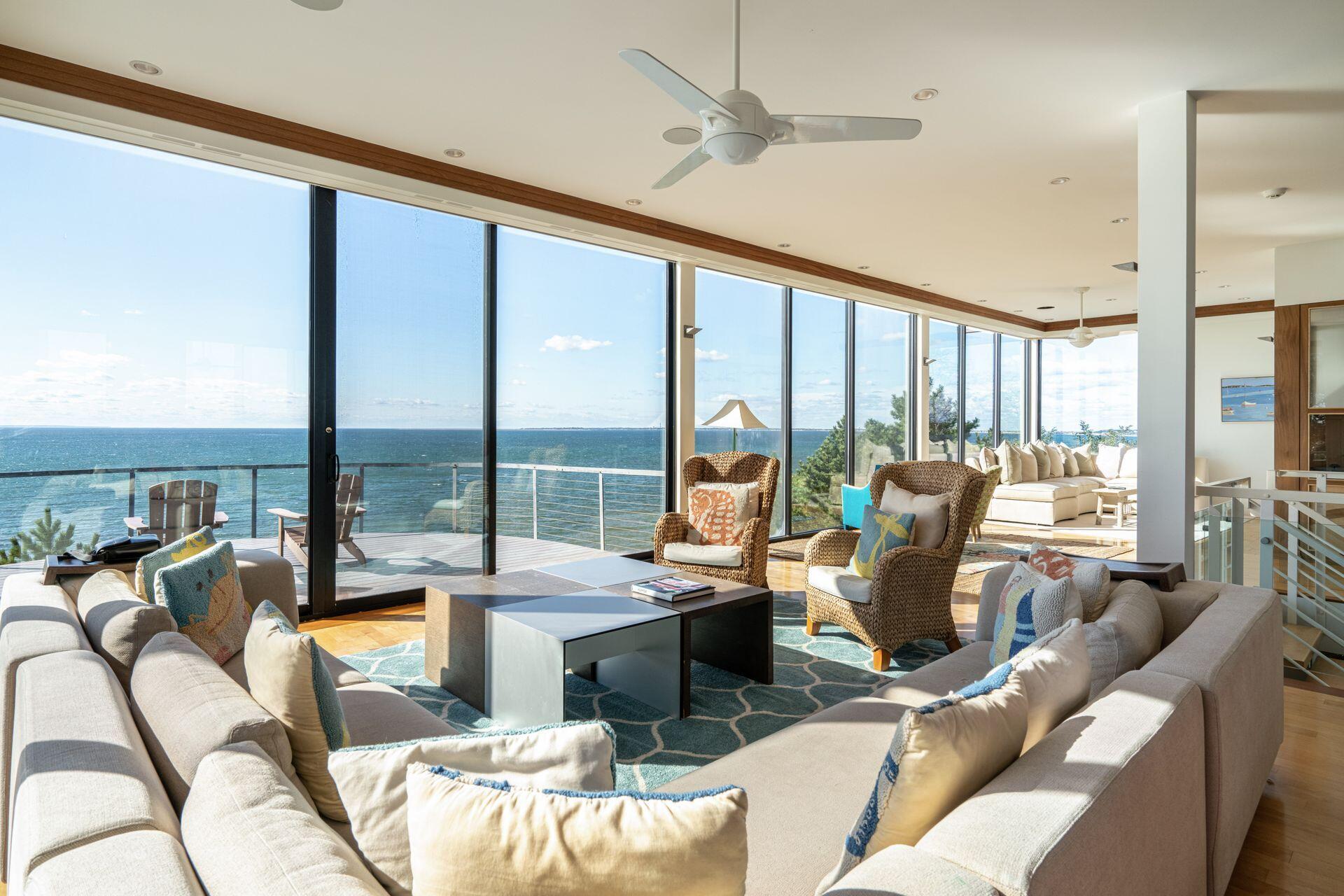 6 Payomet Lane Truro, MA 02666 - Photo 21 of 52 a living room with furniture and large windows