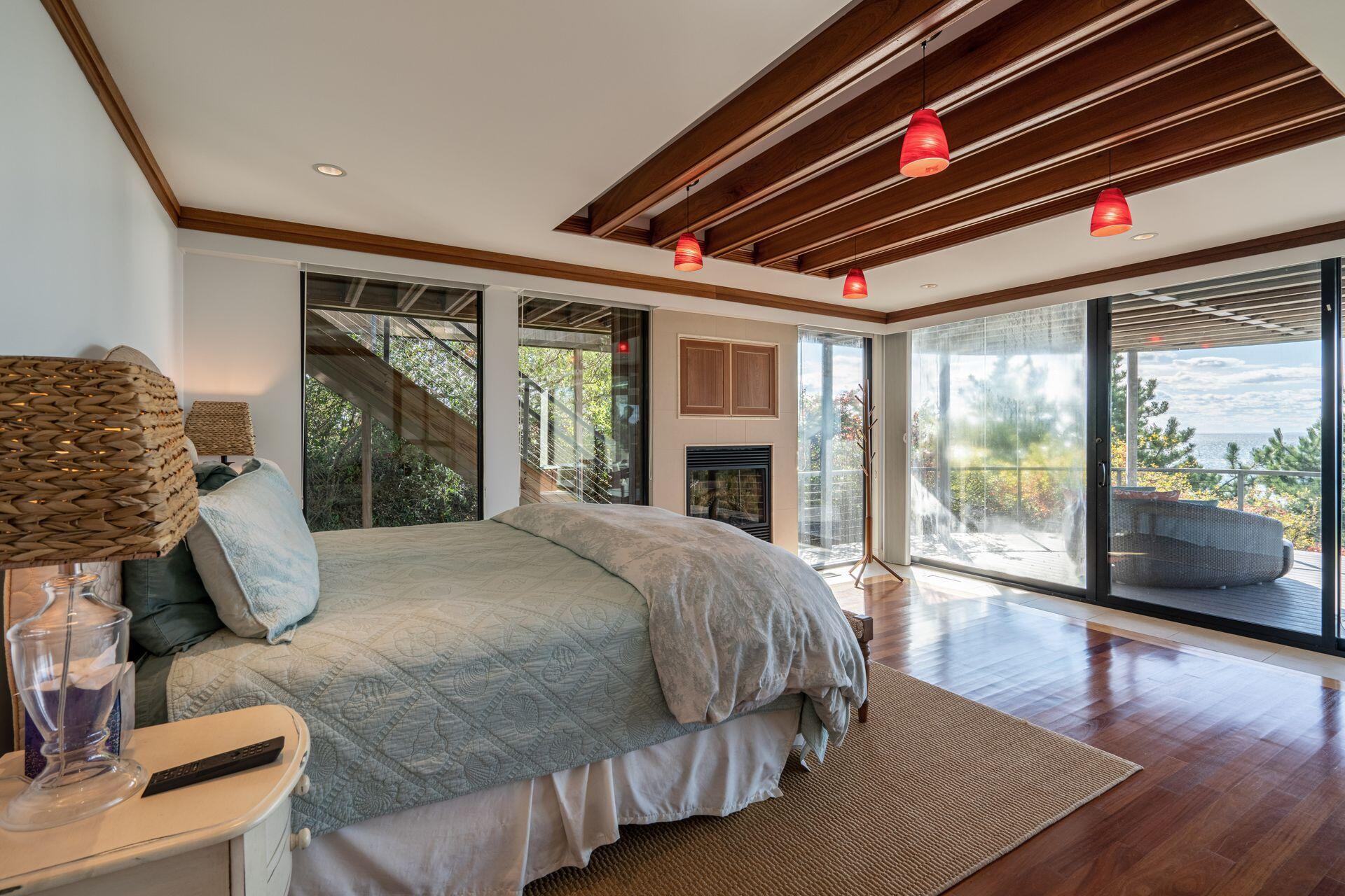 6 Payomet Lane Truro, MA 02666 - Photo 31 of 52 a bedroom with a large bed and a large window