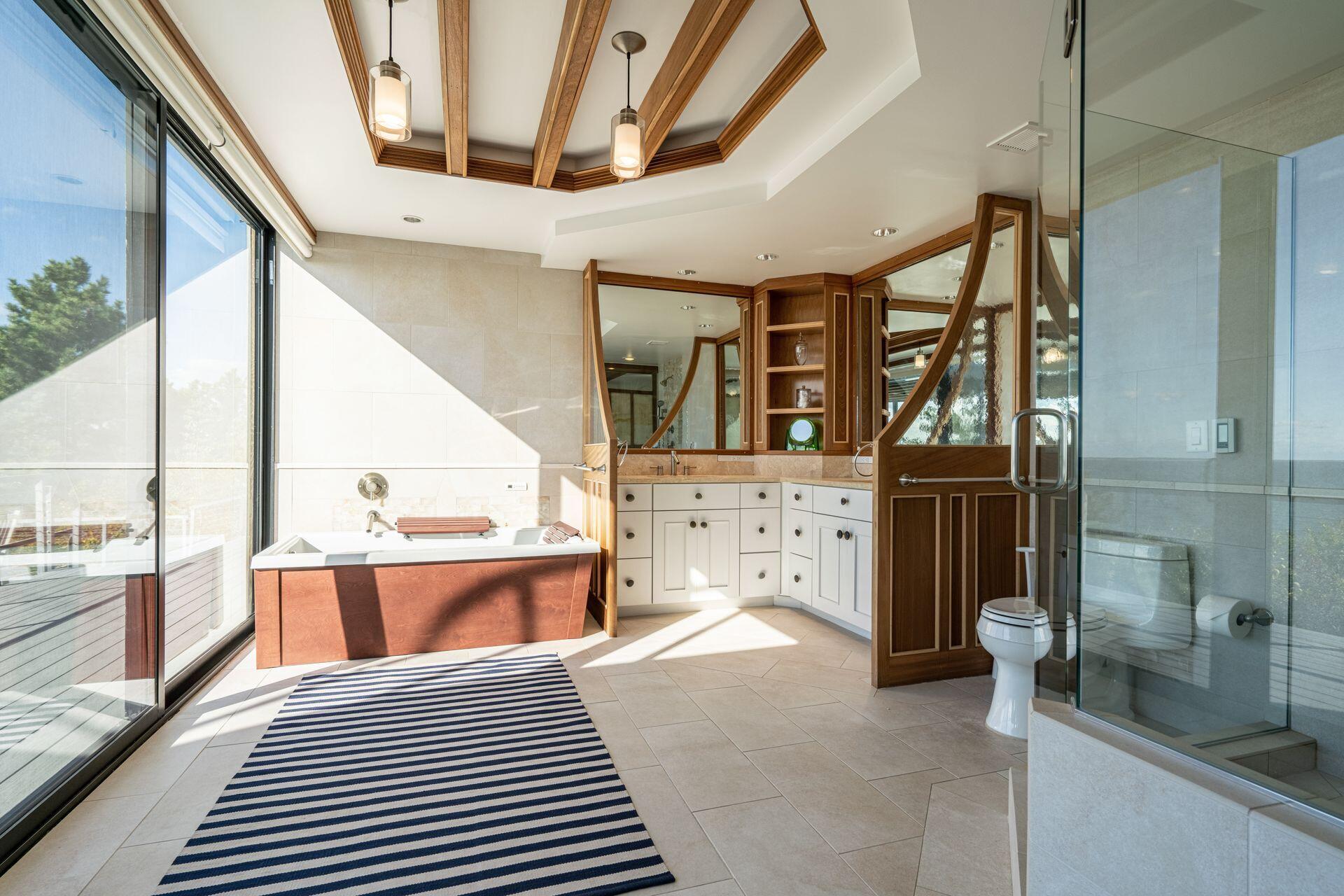 6 Payomet Lane Truro, MA 02666 - Photo 34 of 52 a bedroom with a bed and wooden floor