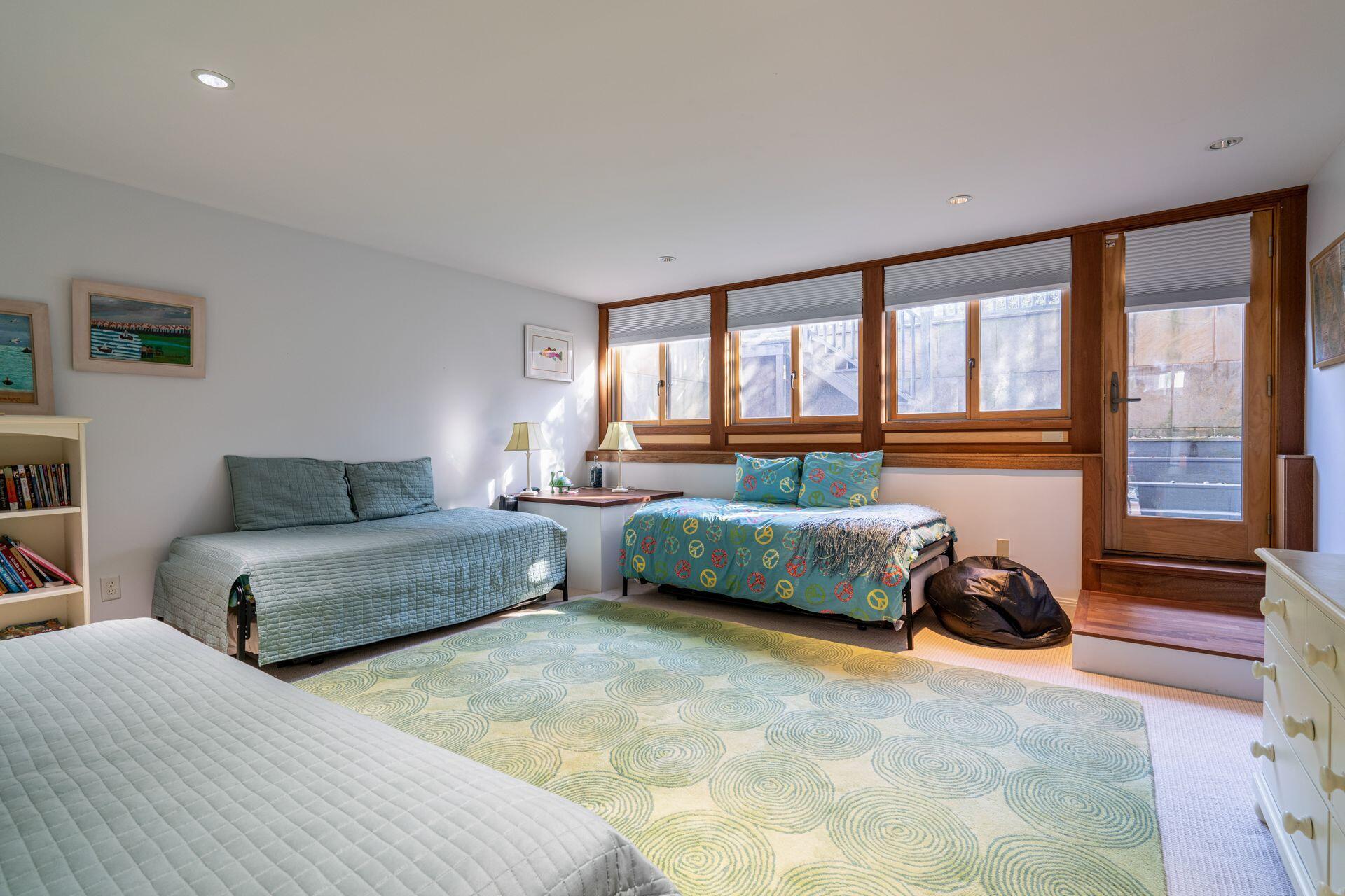 6 Payomet Lane Truro, MA 02666 - Photo 43 of 52 a bedroom with furniture and a large window