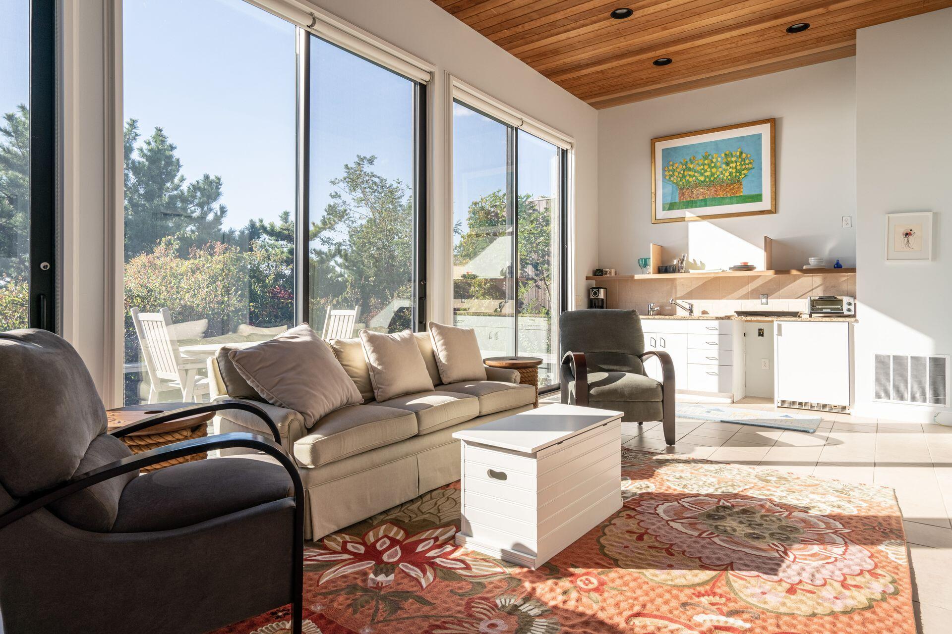 6 Payomet Lane Truro, MA 02666 - Photo 48 of 52 a living room with furniture large window and outer view