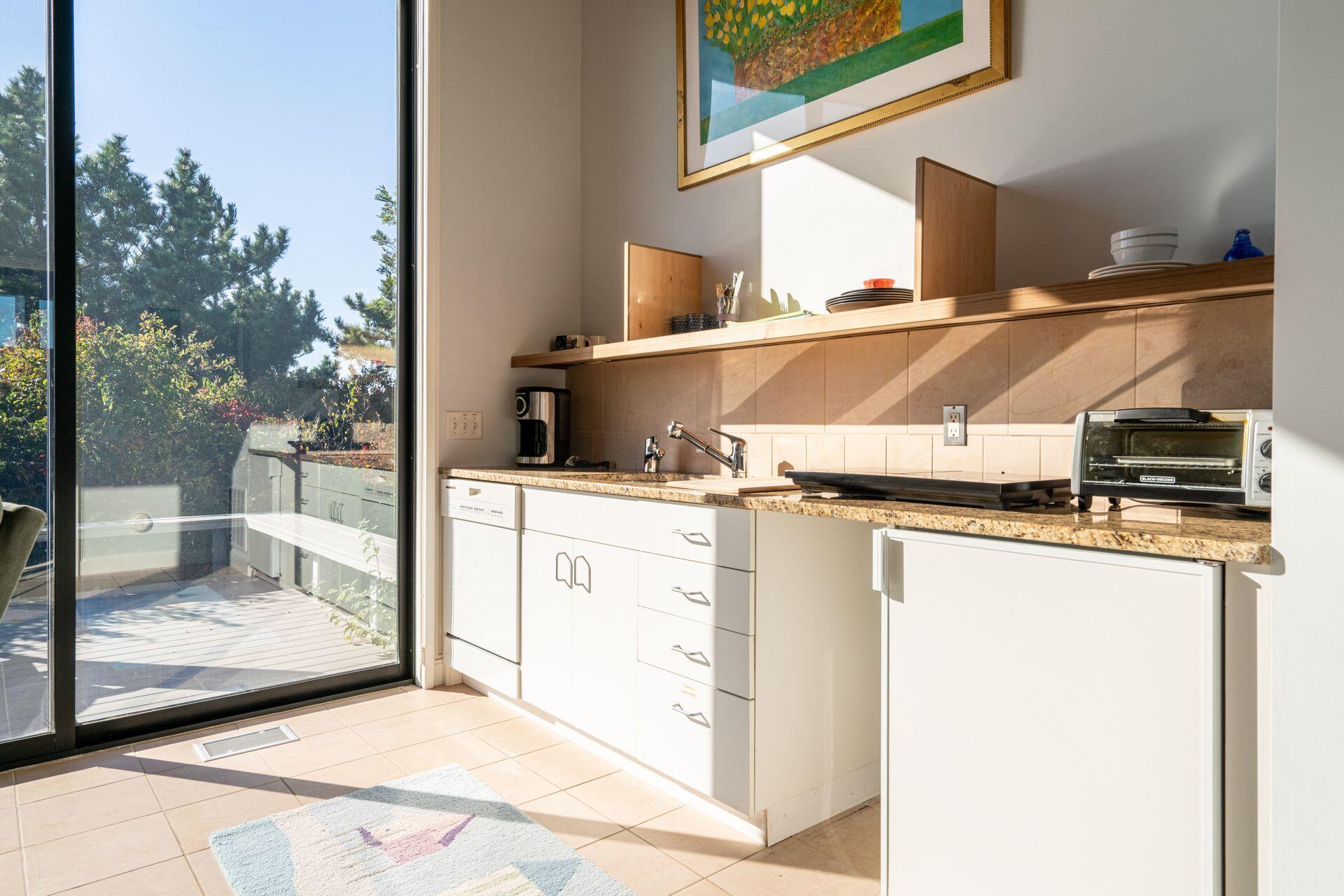 6 Payomet Lane Truro, MA 02666 - Photo 49 of 52 a view of a living room with a large kitchen