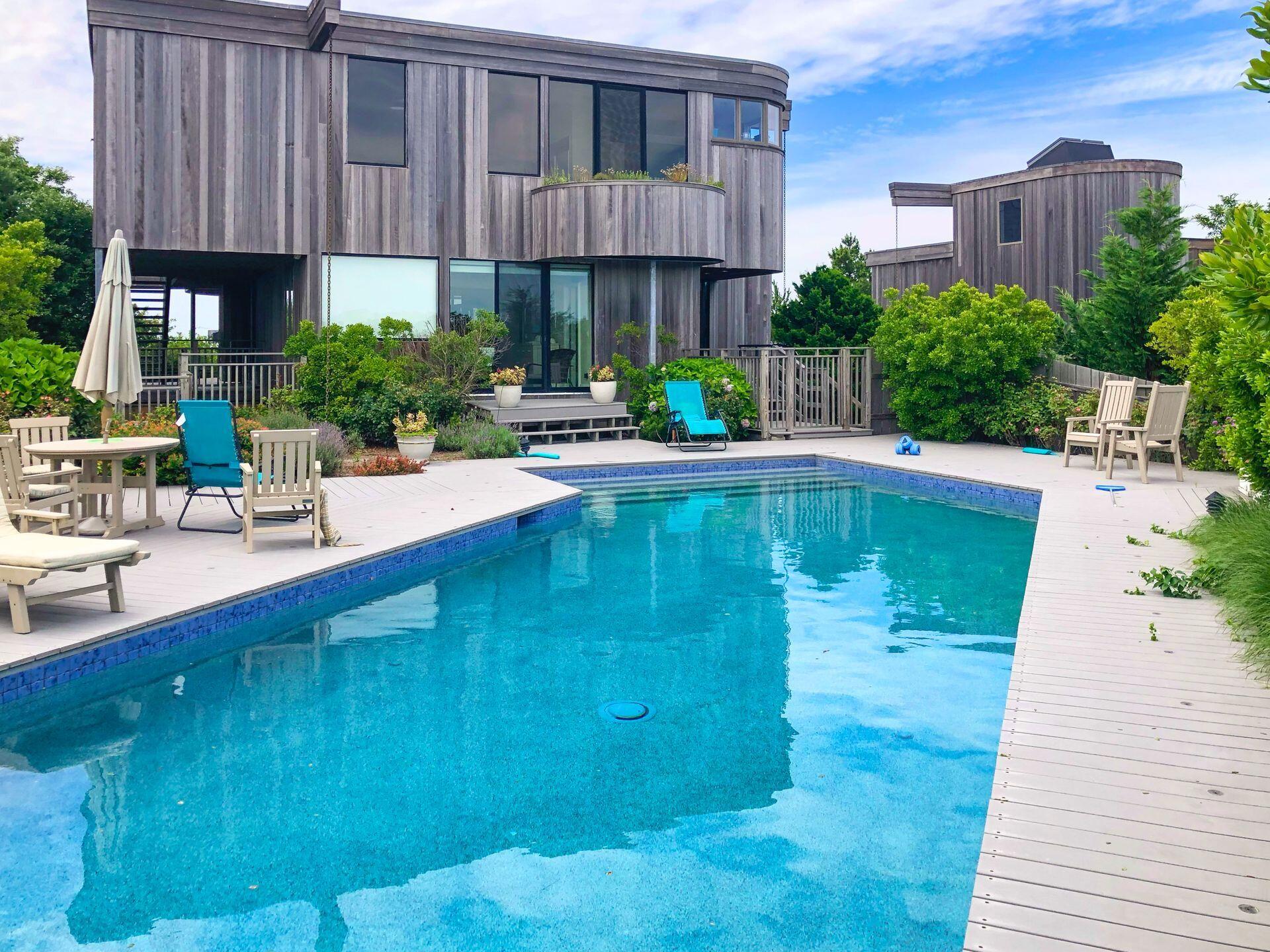 6 Payomet Lane Truro, MA 02666 - Photo 50 of 52 a swimming pool with outdoor seating and yard