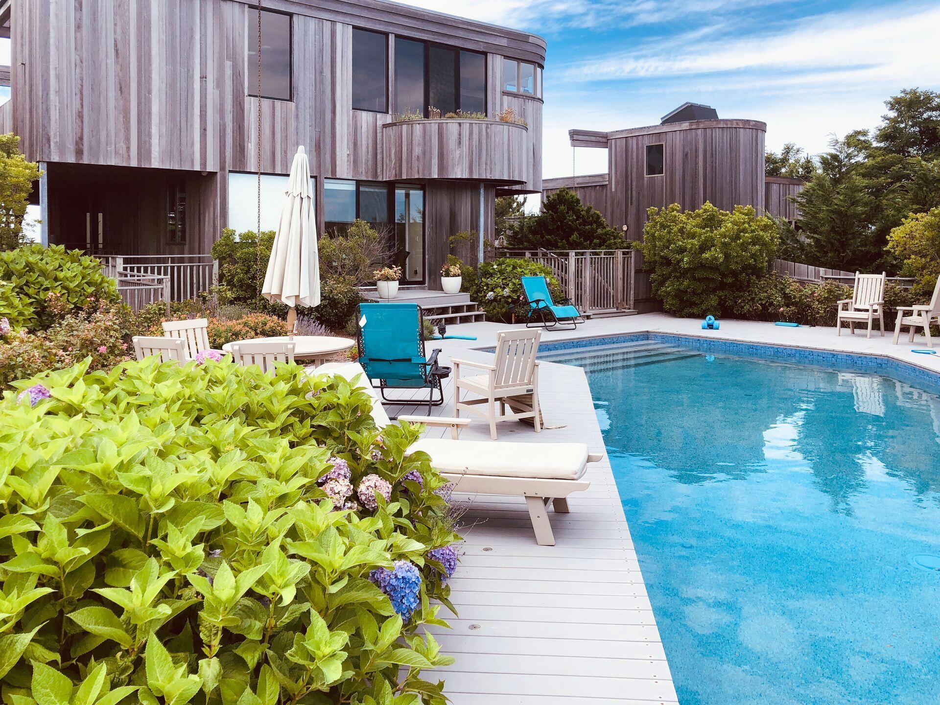 6 Payomet Lane Truro, MA 02666 - Photo 51 of 52 a view of a patio with a table and chairs in patio