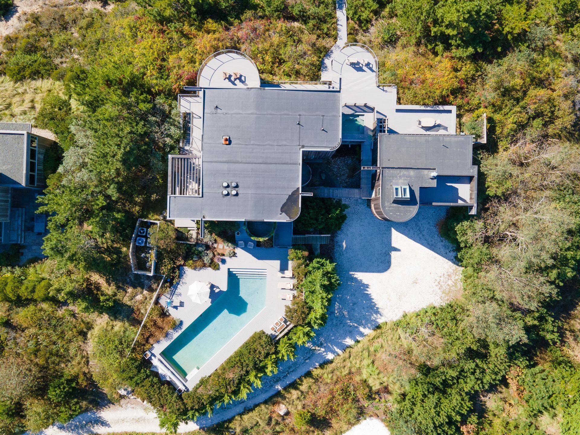 6 Payomet Lane Truro, MA 02666 - Photo 8 of 52 an aerial view of a house with a garden and trees