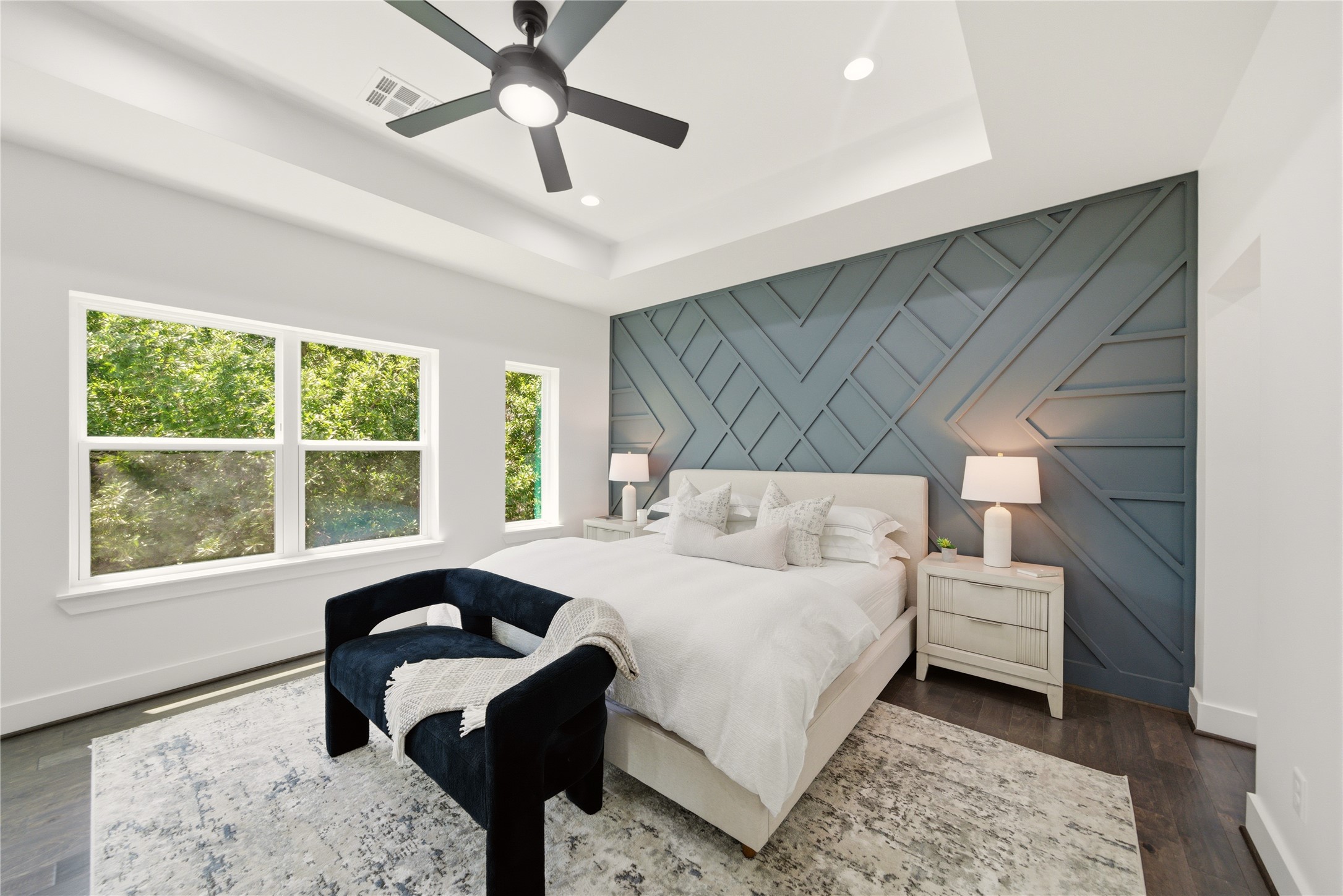 5024 Winnetka Street, Unit A Houston, TX 77021 - Photo 6 of 19 Primary suit boast modern accent wall and dark engineered wood floors. With bolted ceiling