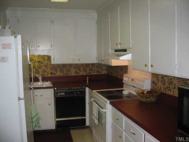 3046 Farrior Road Raleigh, NC 27607 - Photo 4 of 10 a kitchen with a stove and a refrigerator