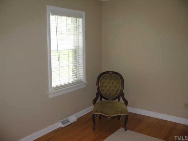 3046 Farrior Road Raleigh, NC 27607 - Photo 6 of 10 a room with wooden door and windows