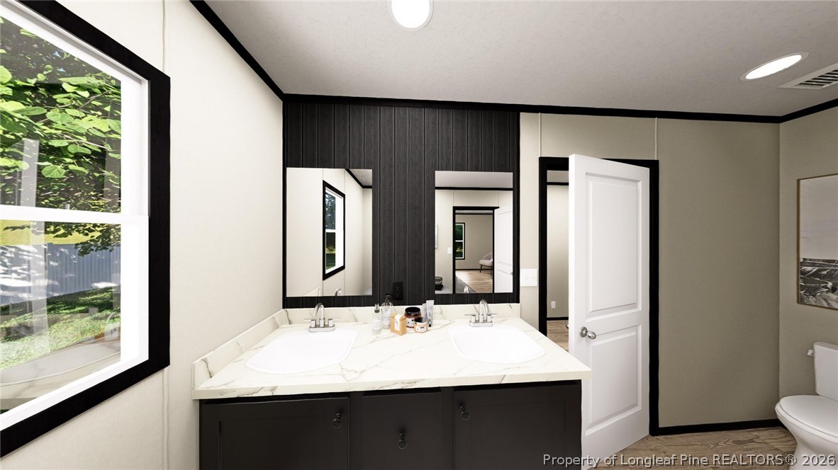 11 Belford Church Road Jackson Springs, NC 27281 - Photo 8 of 10 a bathroom with 2 sink and a mirror