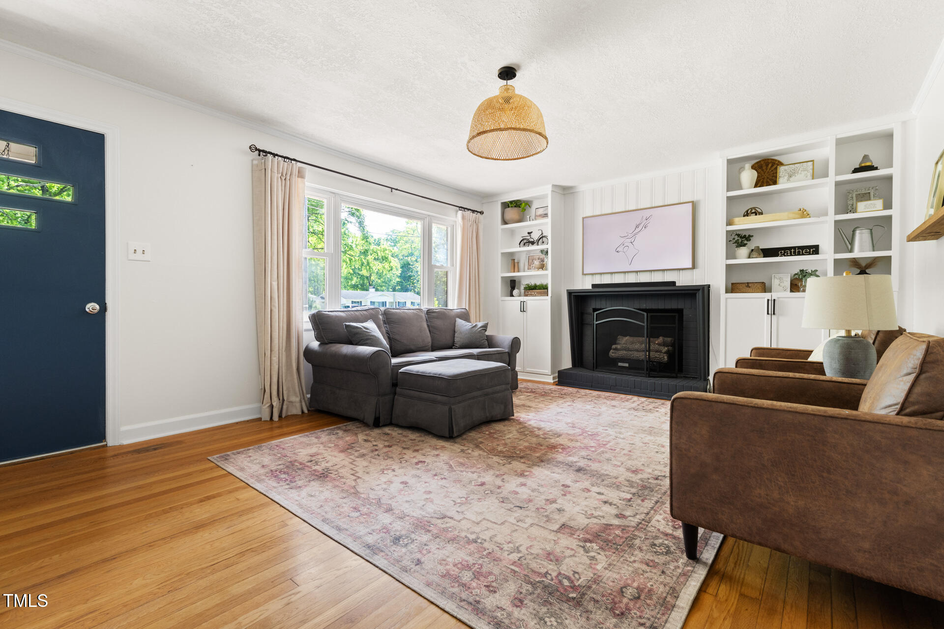 2702 Richwood Road Durham, NC 27705 - Photo 11 of 47 a living room with furniture window and a fireplace