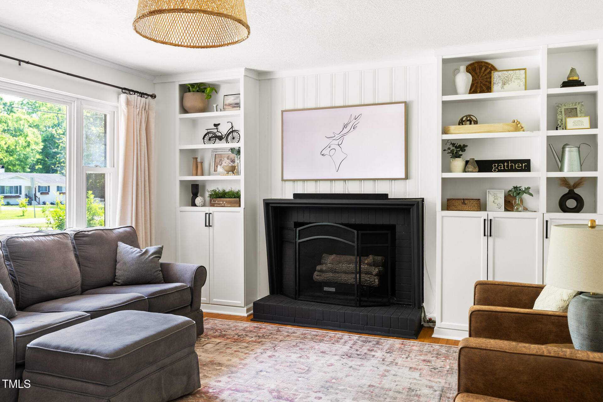 2702 Richwood Road Durham, NC 27705 - Photo 13 of 47 a living room with furniture a window and a fireplace