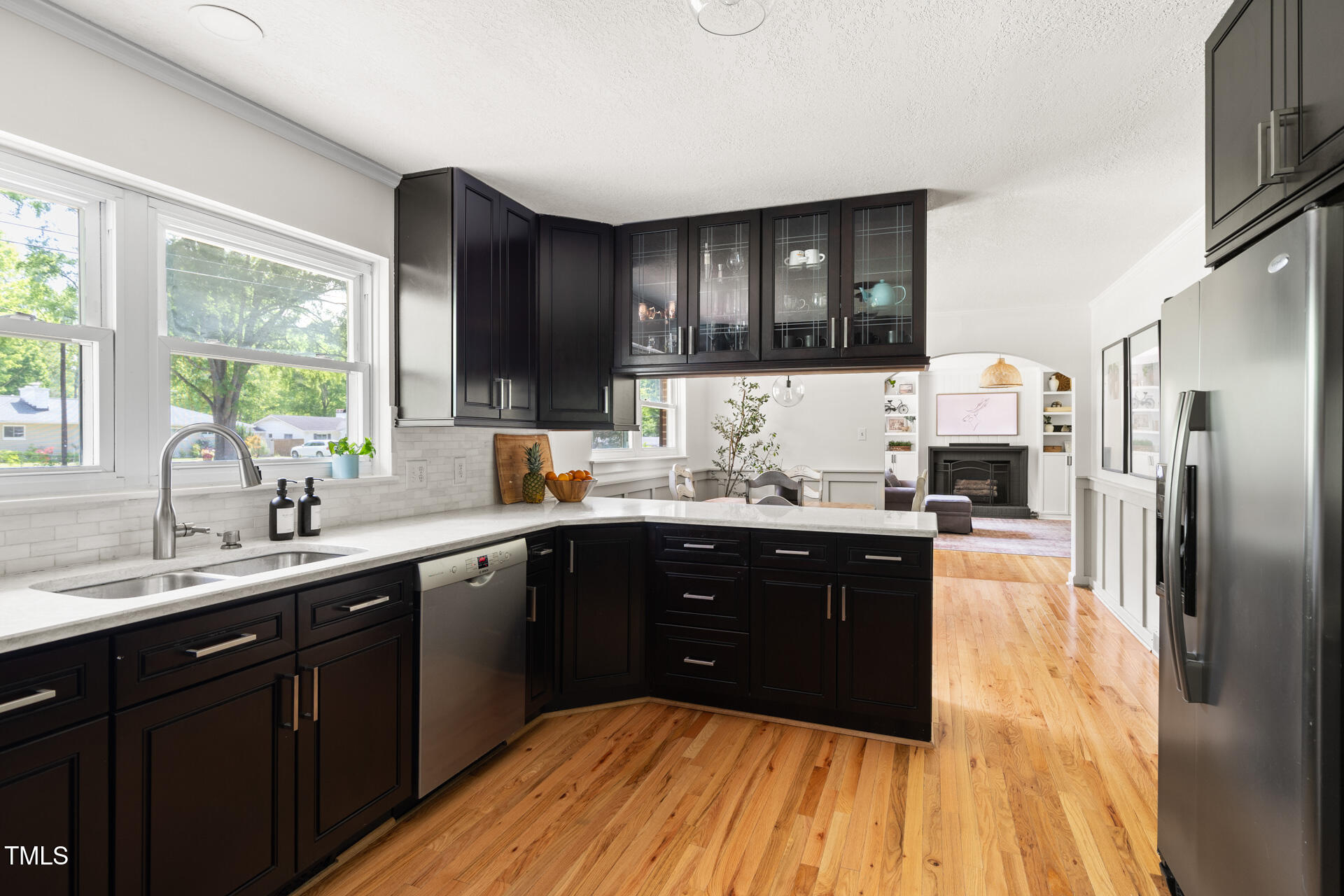 2702 Richwood Road Durham, NC 27705 - Photo 23 of 47 a kitchen with a sink and wooden cabinets