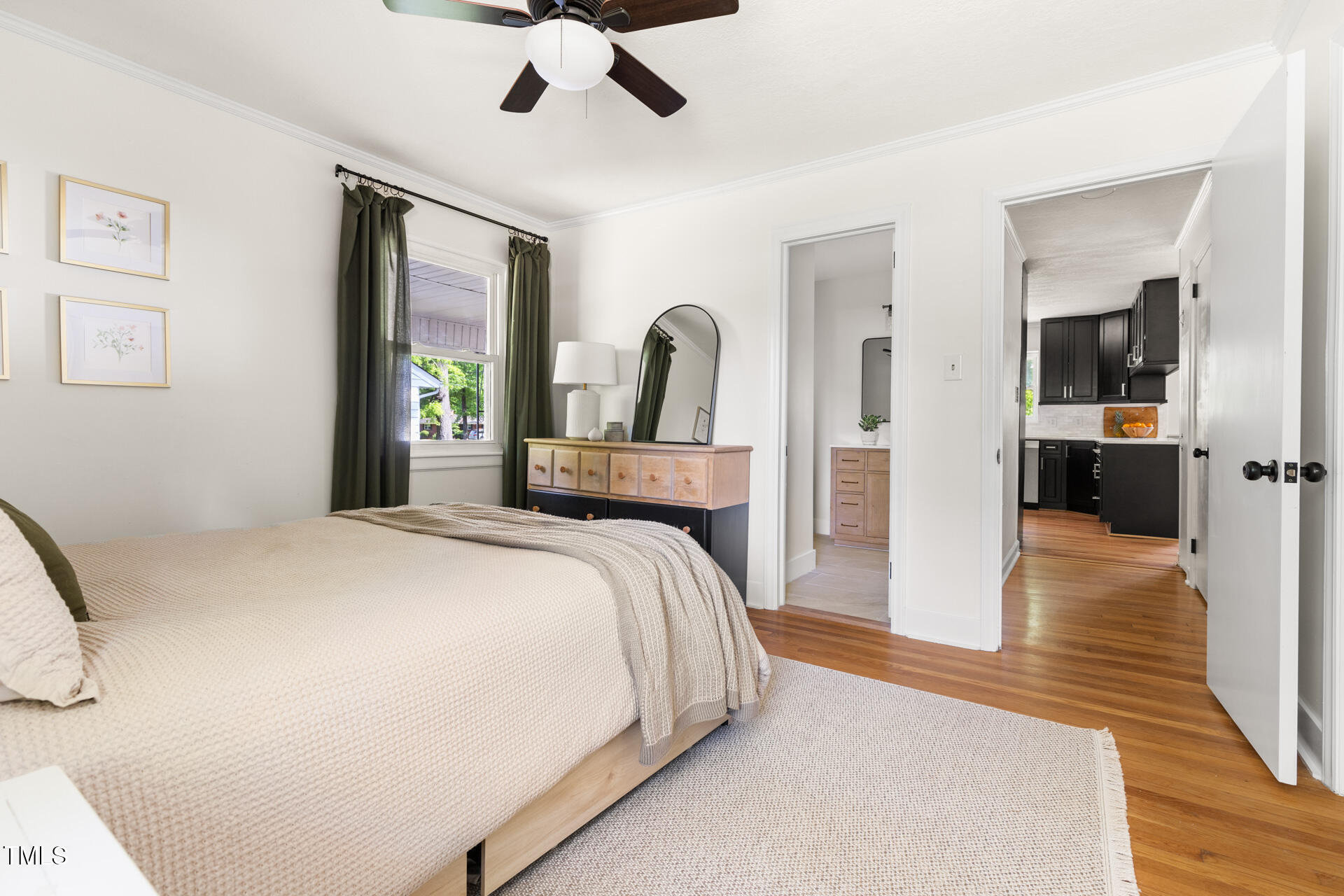 2702 Richwood Road Durham, NC 27705 - Photo 30 of 47 a bedroom with a bed and a large mirror on the dresser