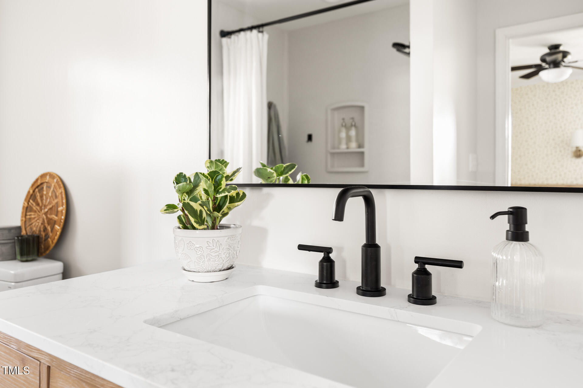 2702 Richwood Road Durham, NC 27705 - Photo 33 of 47 a bathroom with a sink a vanity and a mirror