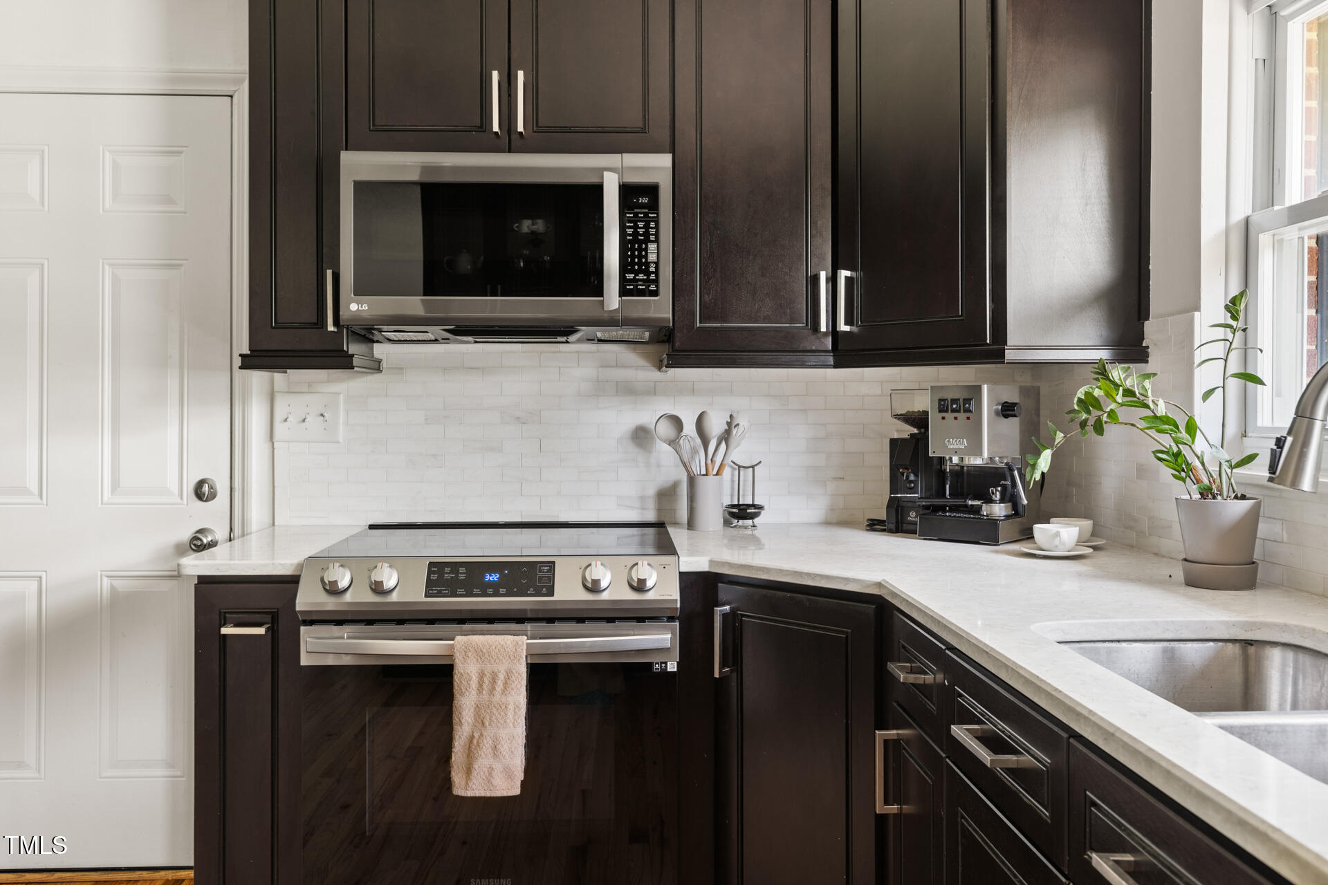 2702 Richwood Road Durham, NC 27705 - Photo 3 of 47 a kitchen with a sink stove and microwave