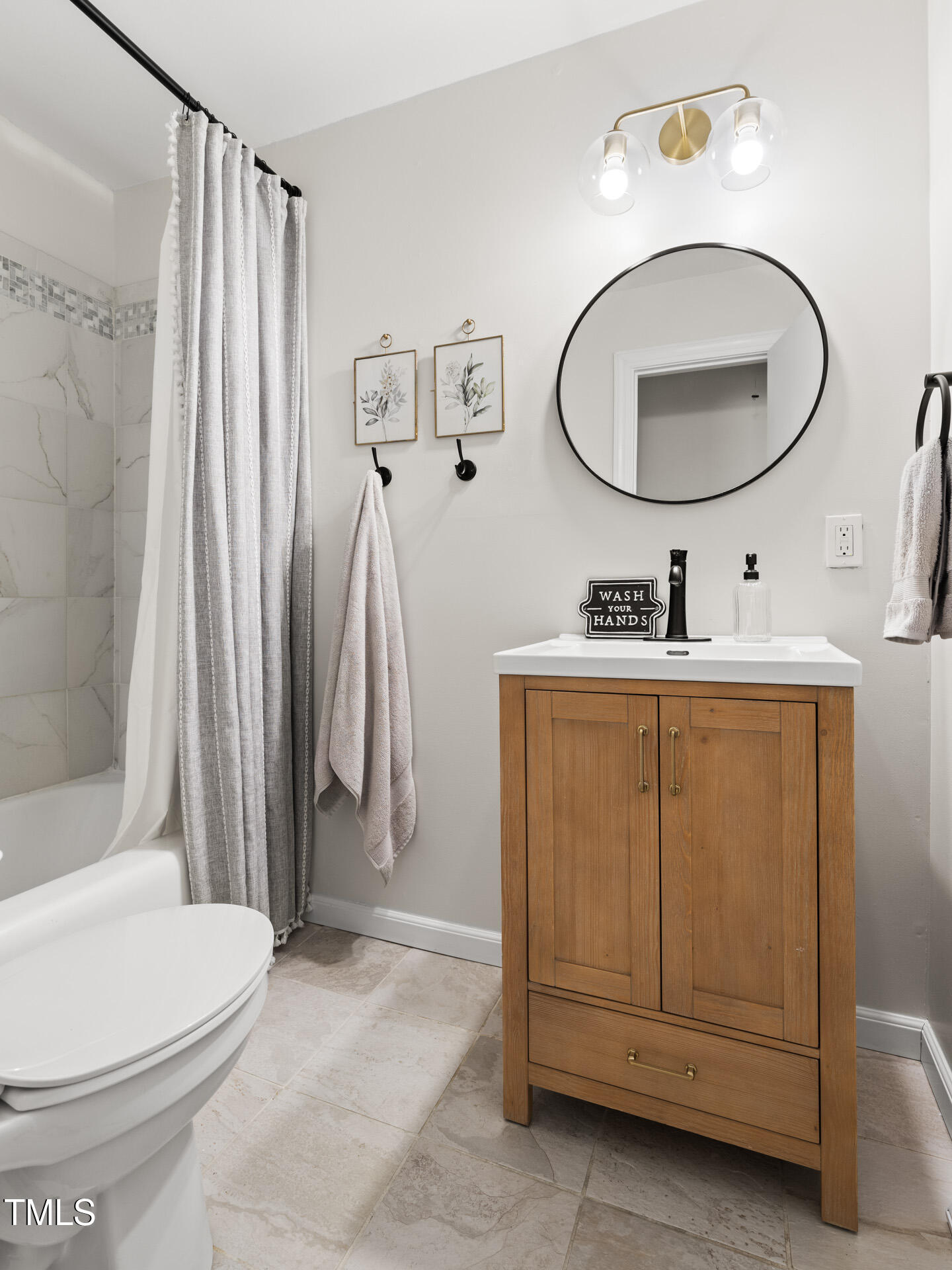 2702 Richwood Road Durham, NC 27705 - Photo 40 of 47 a bathroom with a sink a toilet and a mirror