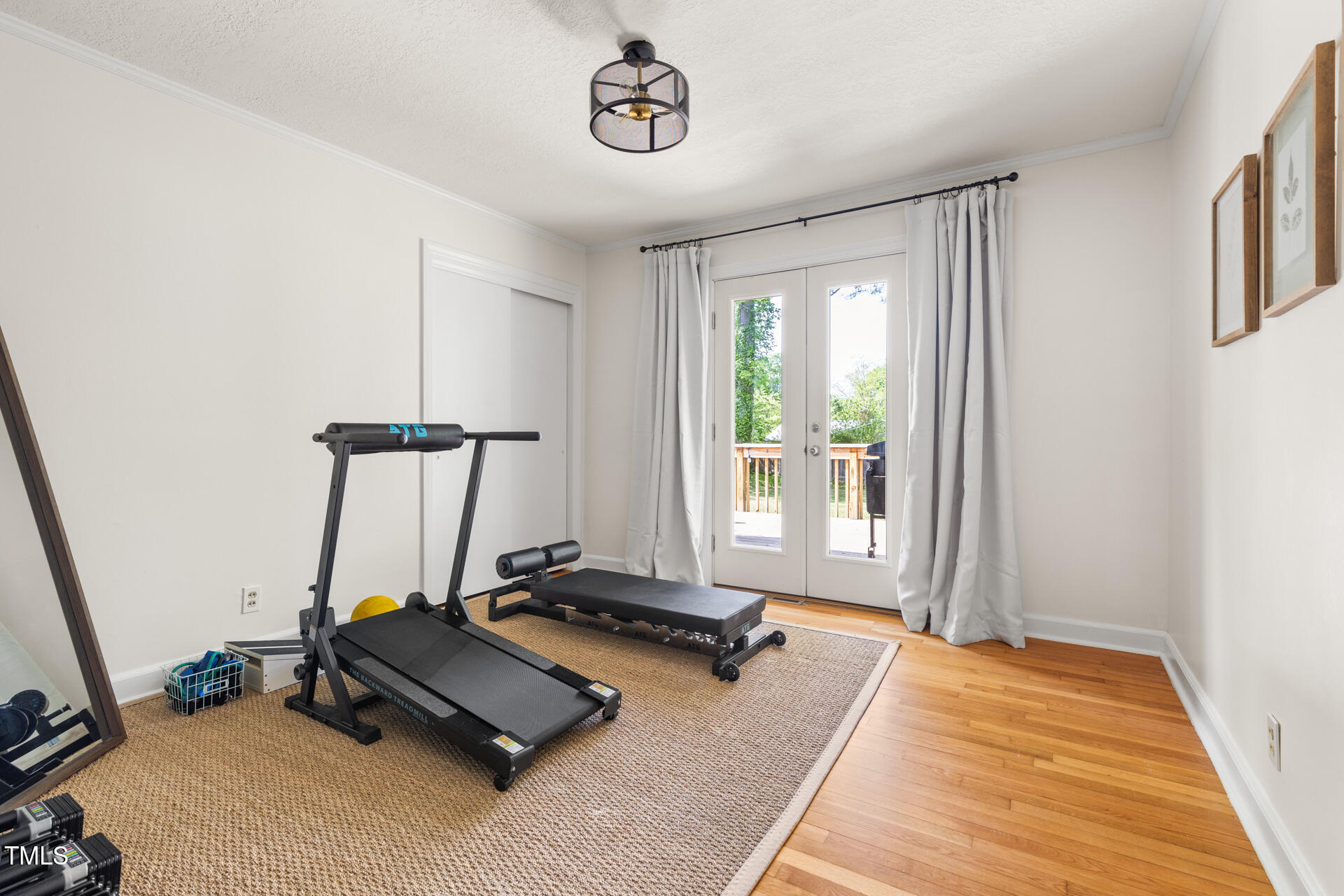 2702 Richwood Road Durham, NC 27705 - Photo 42 of 47 a room with gym equipment and windows