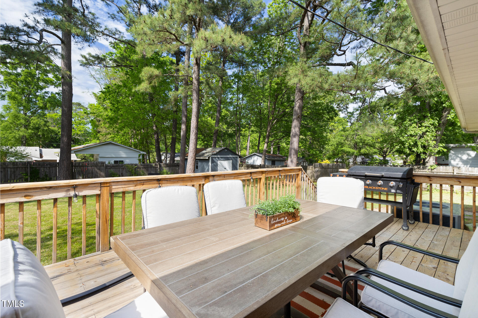 2702 Richwood Road Durham, NC 27705 - Photo 44 of 47 a view of deck with a table and chairs