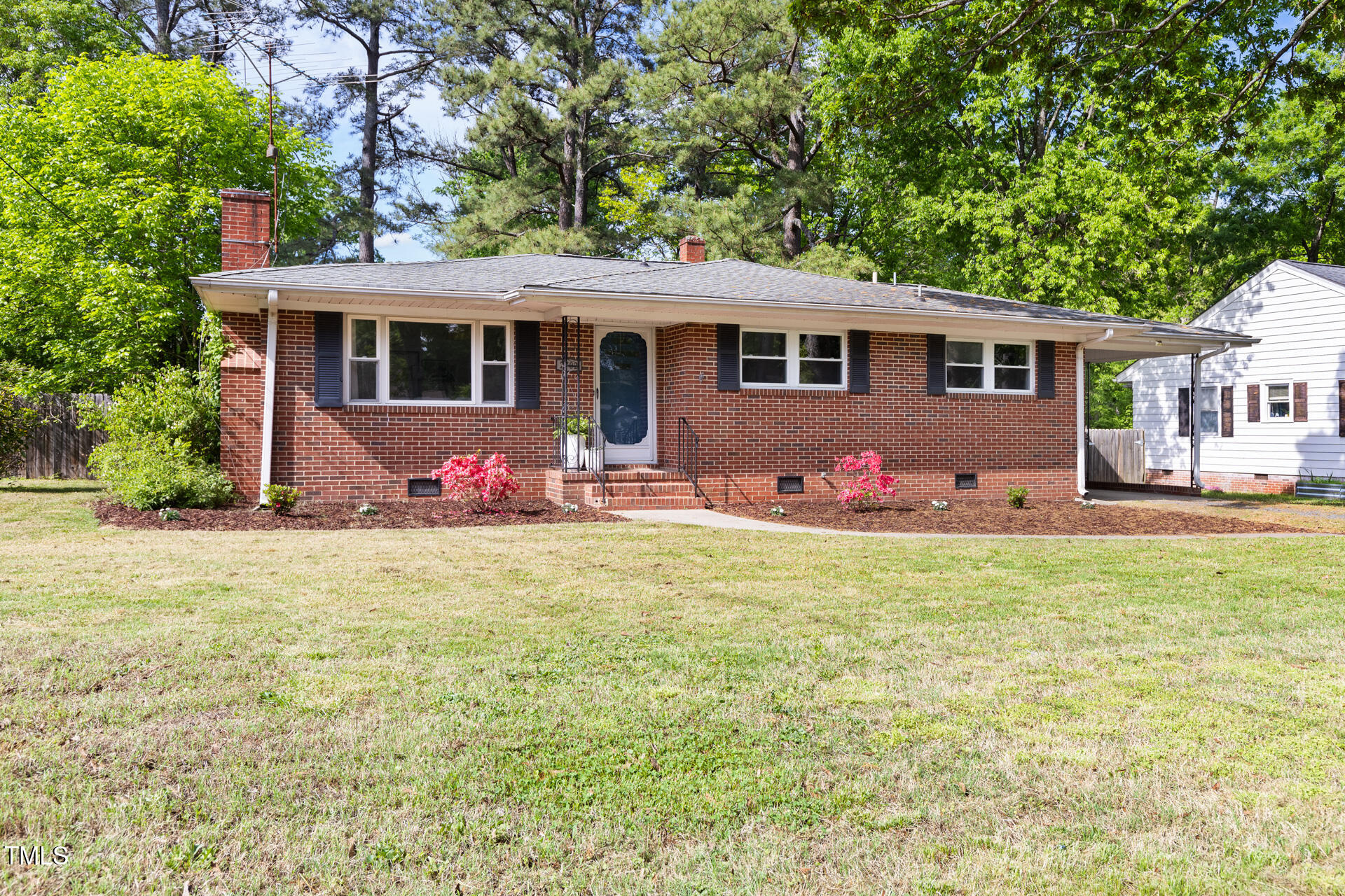 2702 Richwood Road Durham, NC 27705 - Photo 6 of 47 a front view of house with yard and trees around