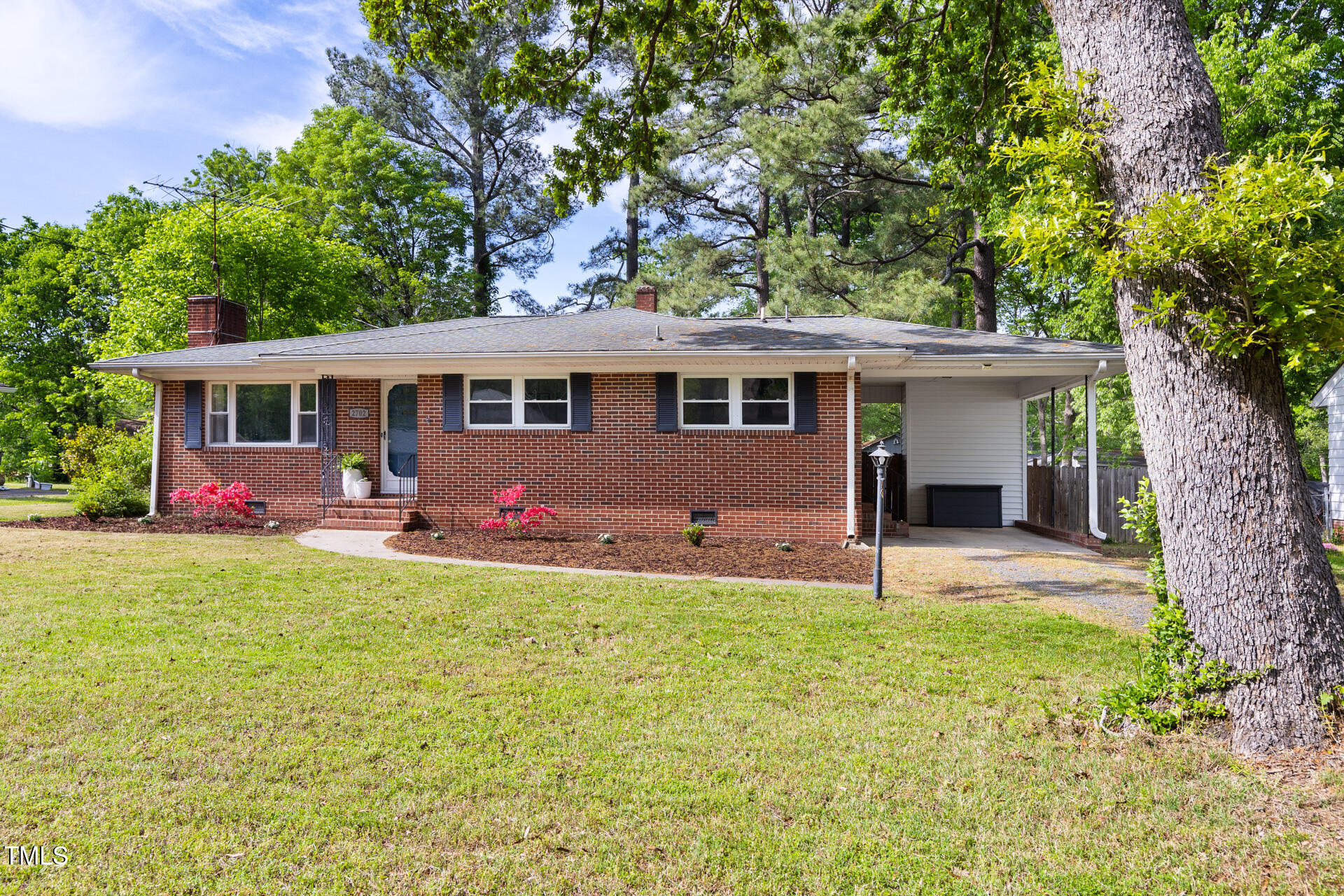 2702 Richwood Road Durham, NC 27705 - Photo 7 of 47 a view of a house with a yard and large tree