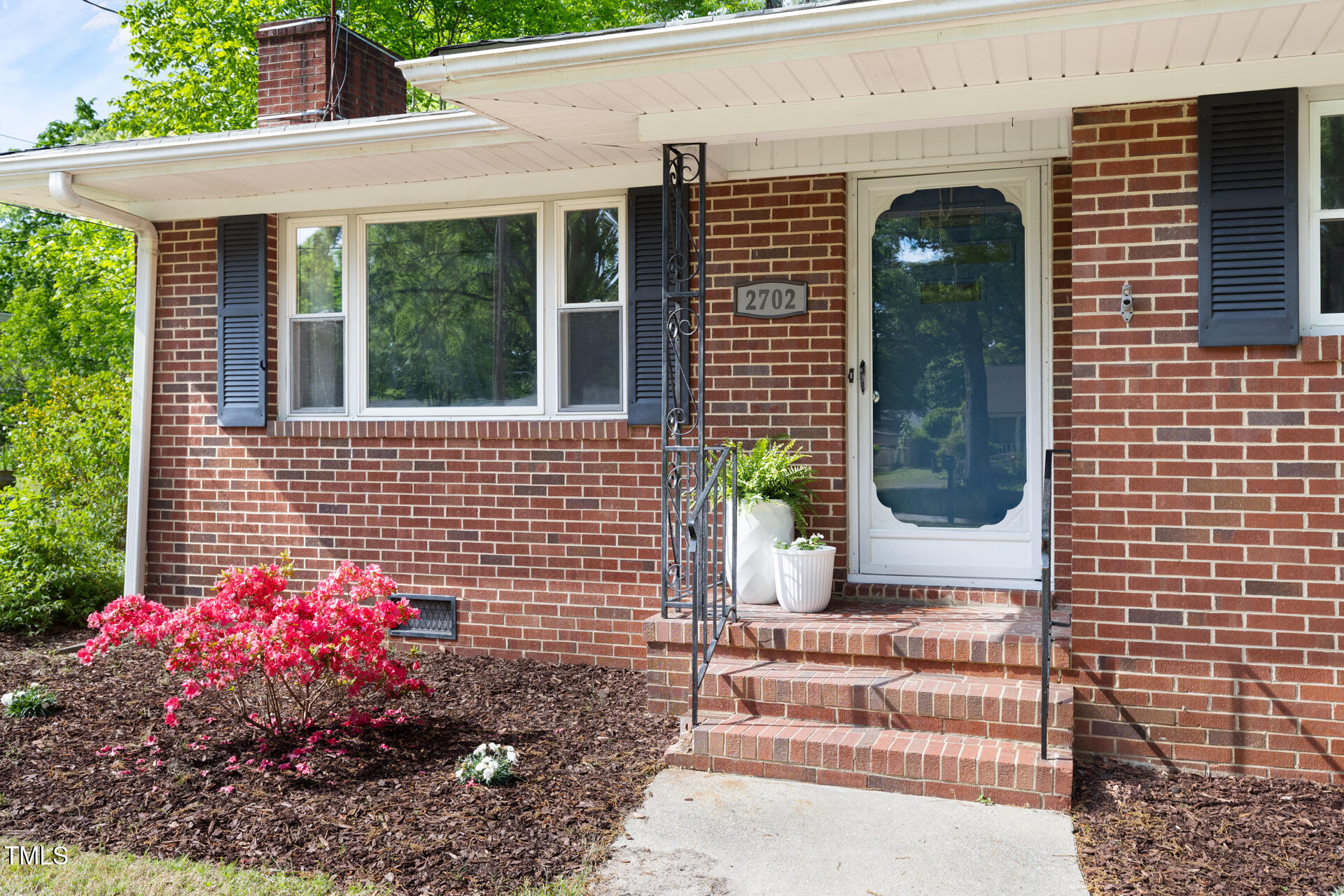 2702 Richwood Road Durham, NC 27705 - Photo 9 of 47 a front view of a house with a garden