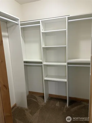 a view of an empty walk in closet