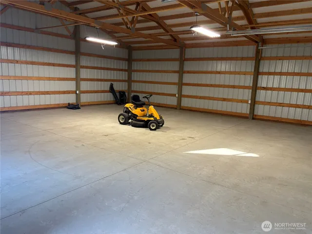 a view of a swimming pool with an outdoor seating and a yard