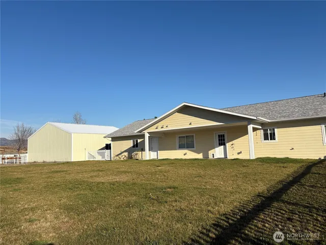 a front view of a house with yard