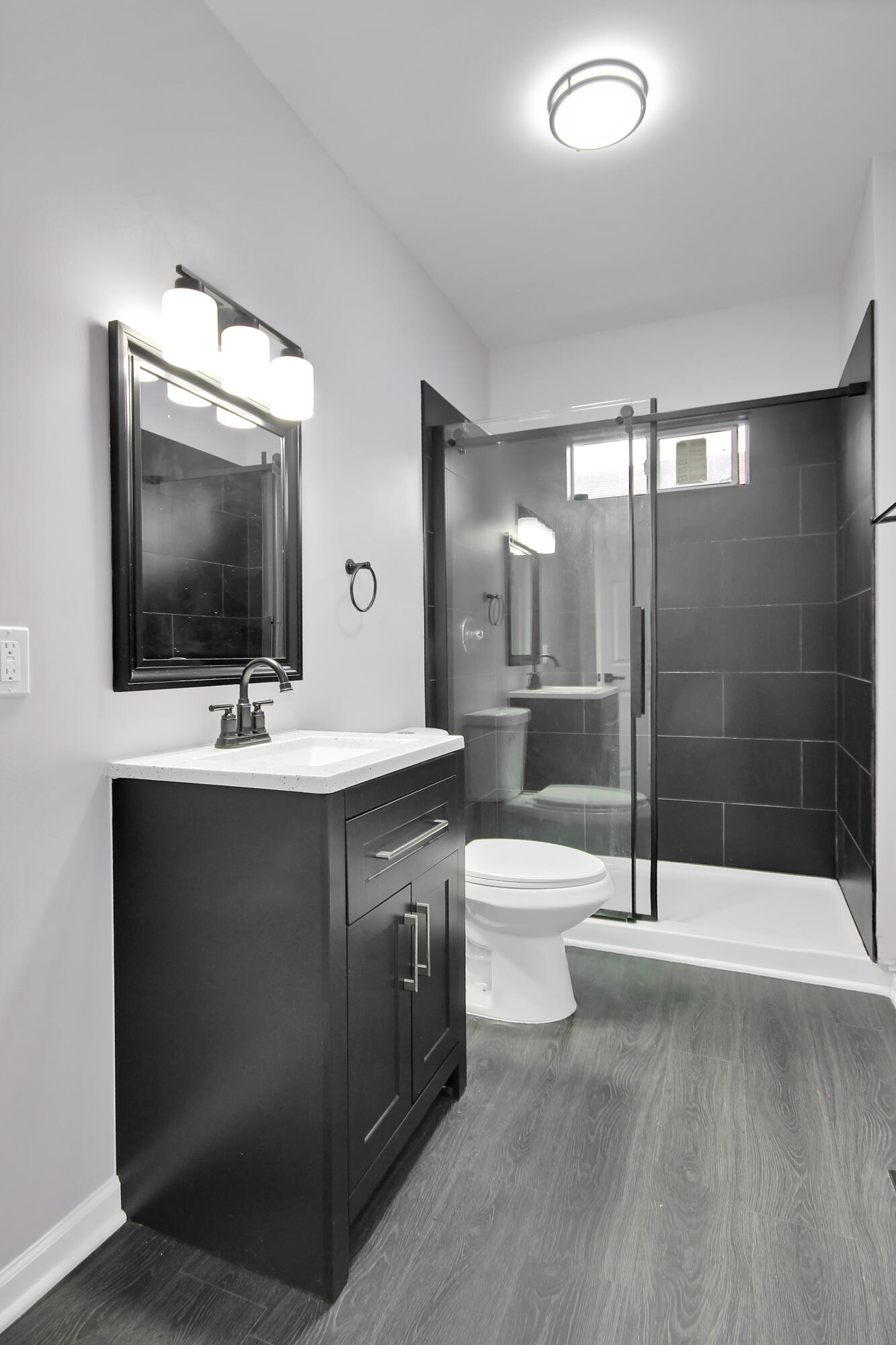 836 Fayette Street Gary, IN 46403 - Photo 6 of 16 a bathroom with a sink a toilet and shower