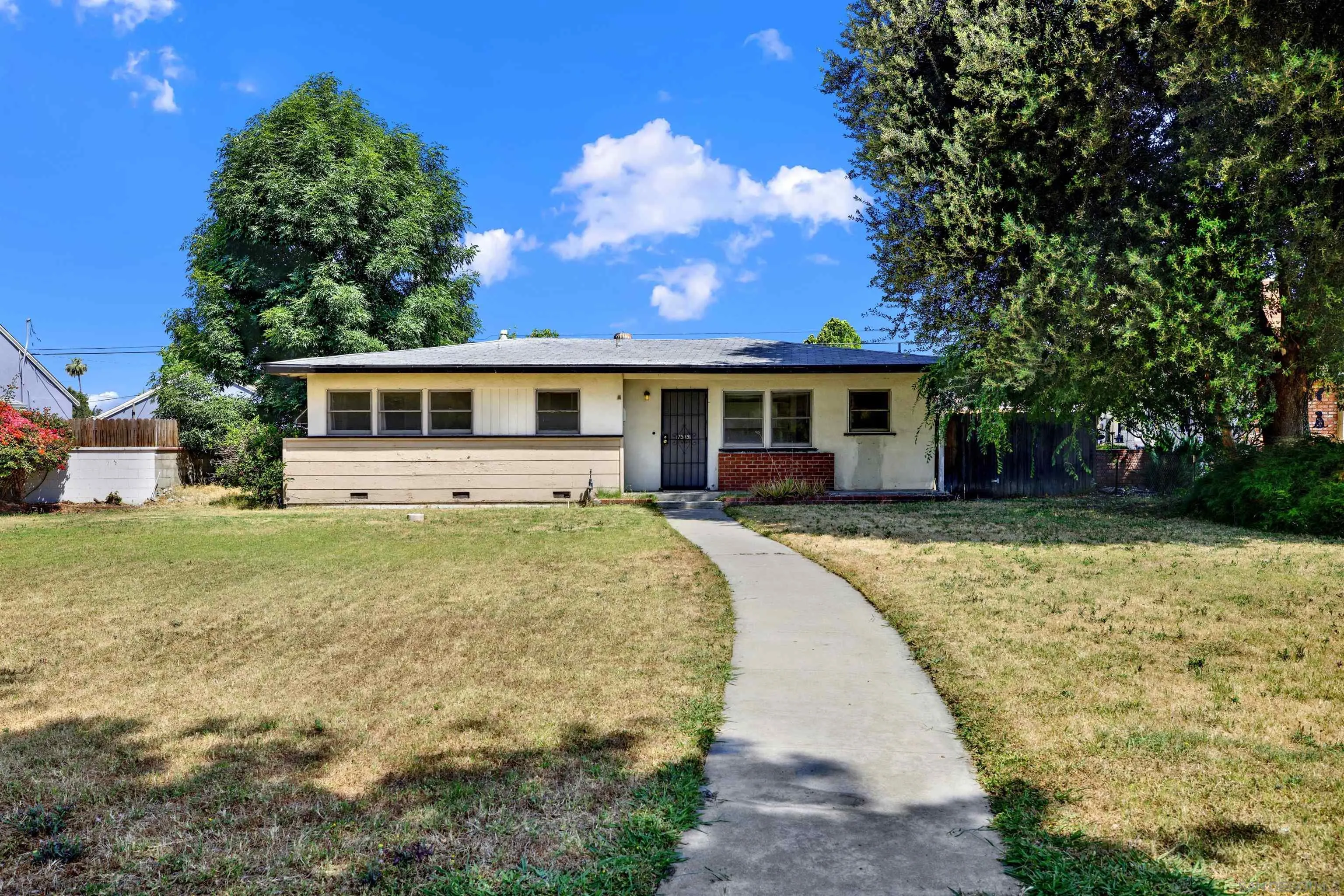 7515 Magnolia Avenue Riverside, CA 92504 - Photo 3 of 40 a view of a house with a backyard