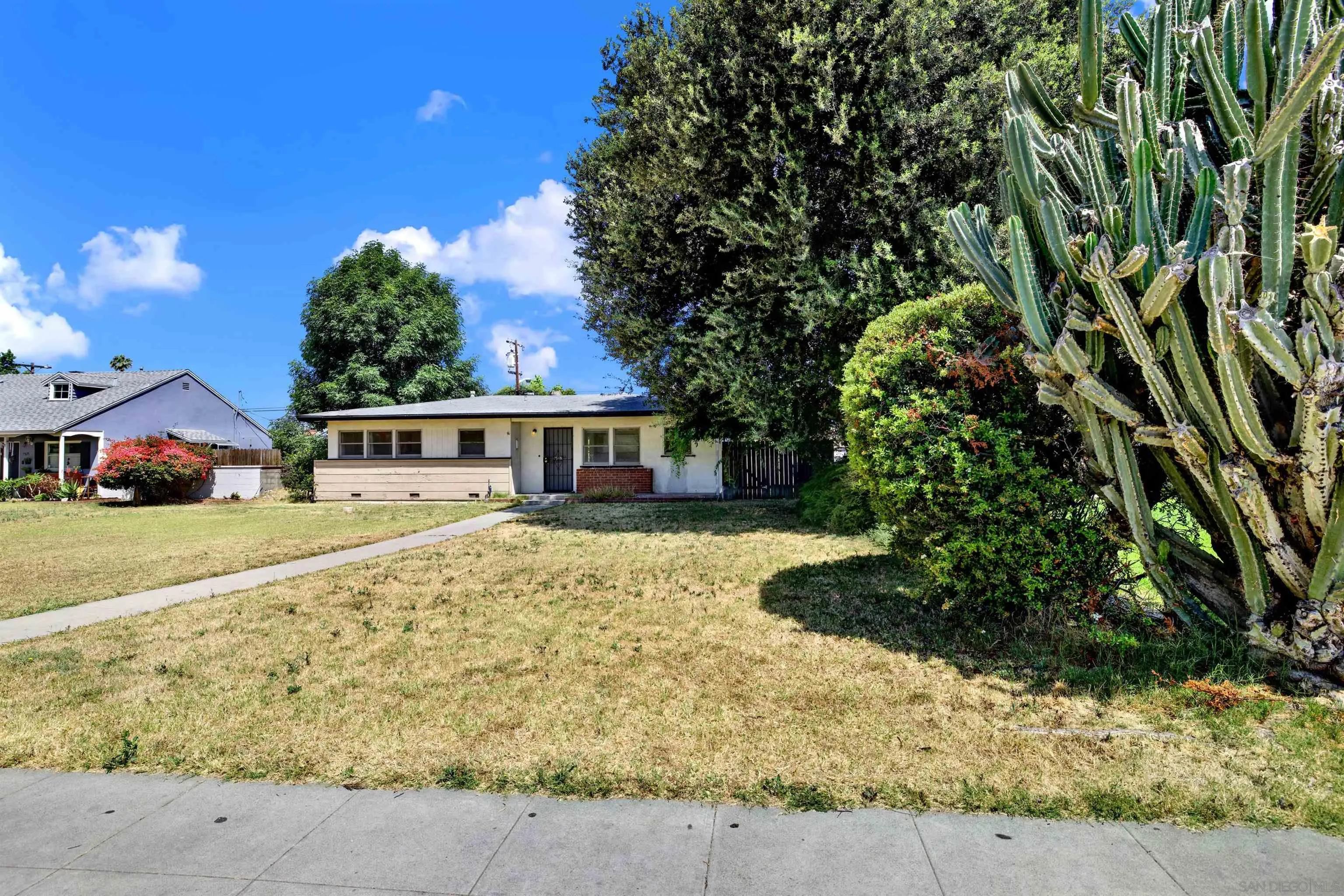 7515 Magnolia Avenue Riverside, CA 92504 - Photo 5 of 40 a front view of a house with garden