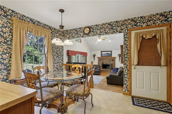 a view of a dining room with furniture window and outside view