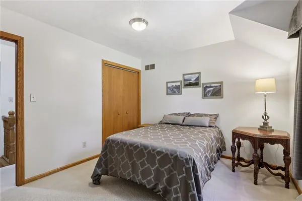 a bedroom with a bed and a table