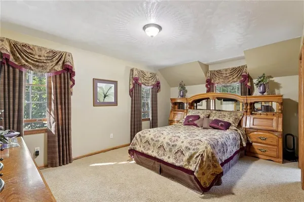 a bedroom with a bed and a cabinets