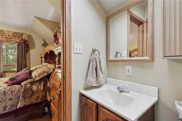 a en suite bathroom with a sink and mirror