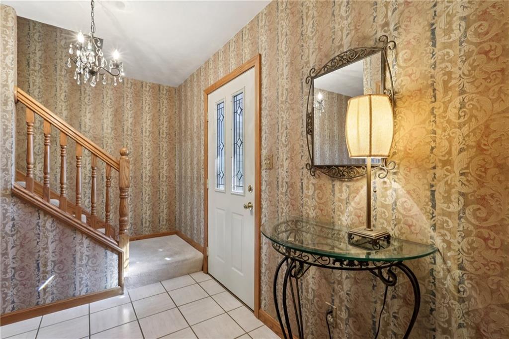 4302 Mitchell Road New Castle, PA 16105 - Photo 3 of 46 a view of a hallway with chandelier and entryway