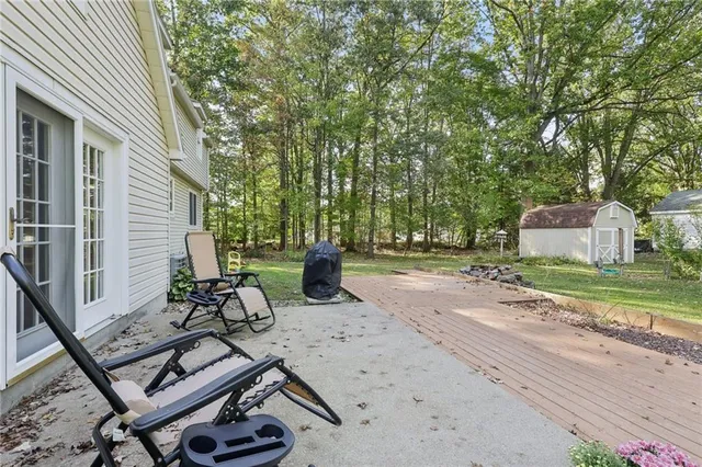 a view of a backyard with sitting area