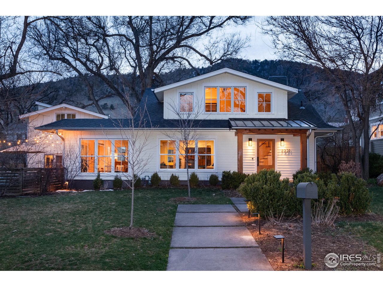 3221 8th Street Boulder, CO 80304 - Photo 1 of 40 a front view of house with yard and green space