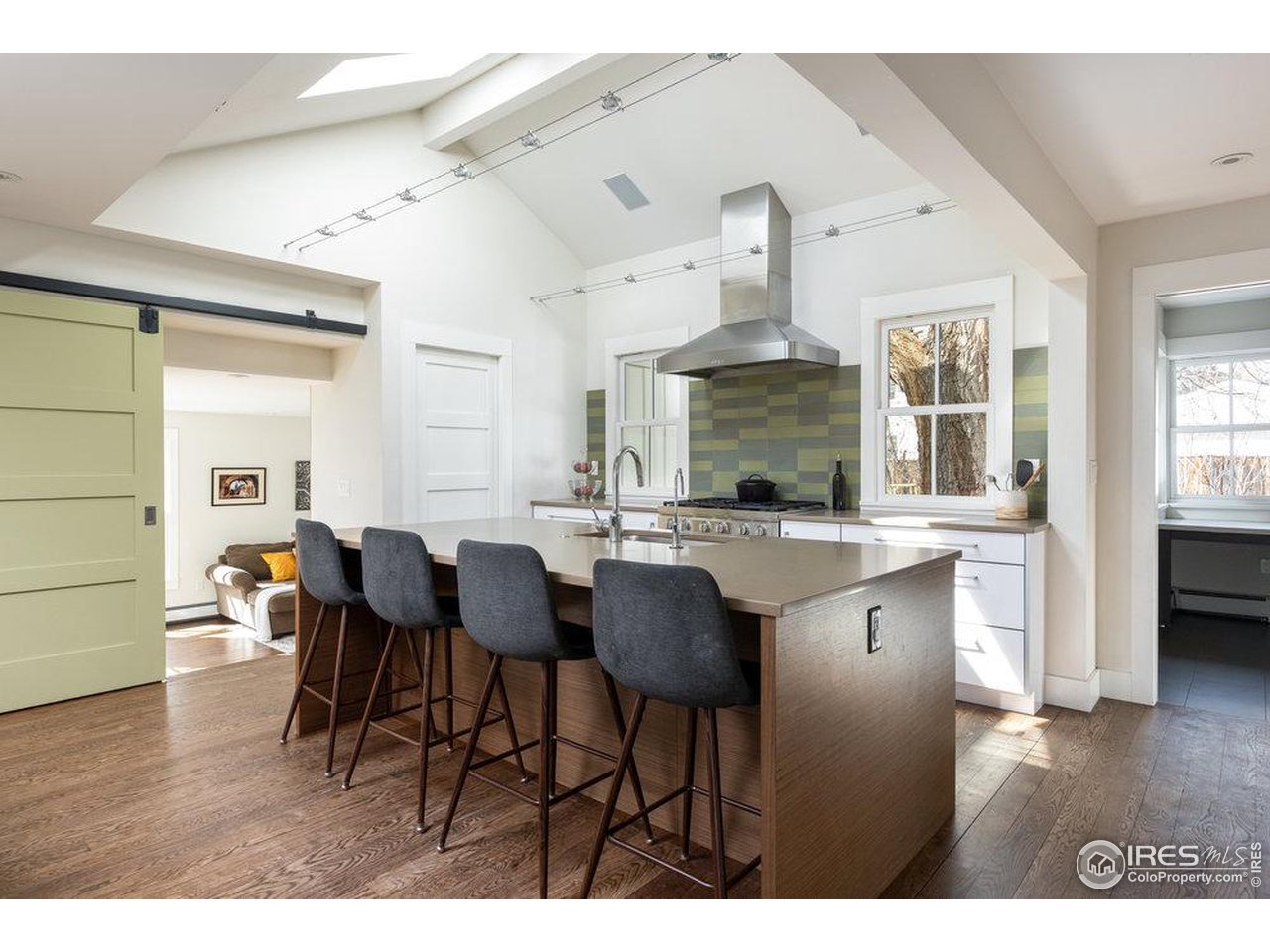 3221 8th Street Boulder, CO 80304 - Photo 11 of 40 a kitchen with stainless steel appliances granite countertop a table and chairs