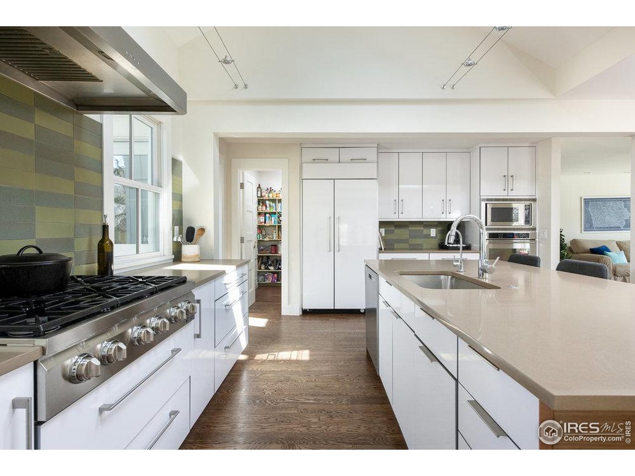 3221 8th Street Boulder, CO 80304 - Photo 13 of 40 a kitchen with stainless steel appliances kitchen island granite countertop a stove a sink and a refrigerator
