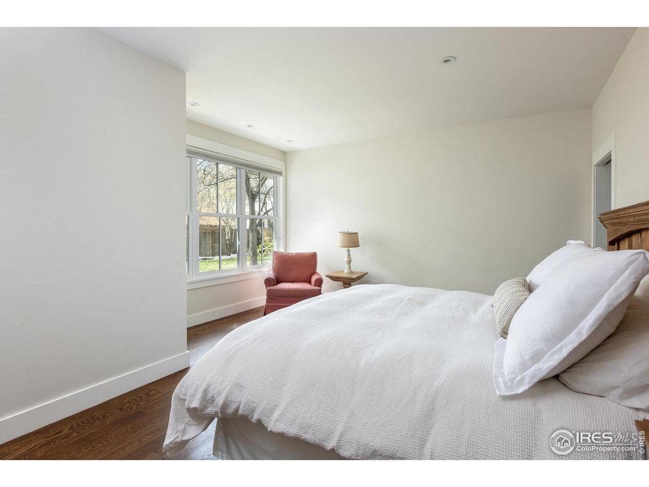3221 8th Street Boulder, CO 80304 - Photo 16 of 40 a bedroom with a bed and a window