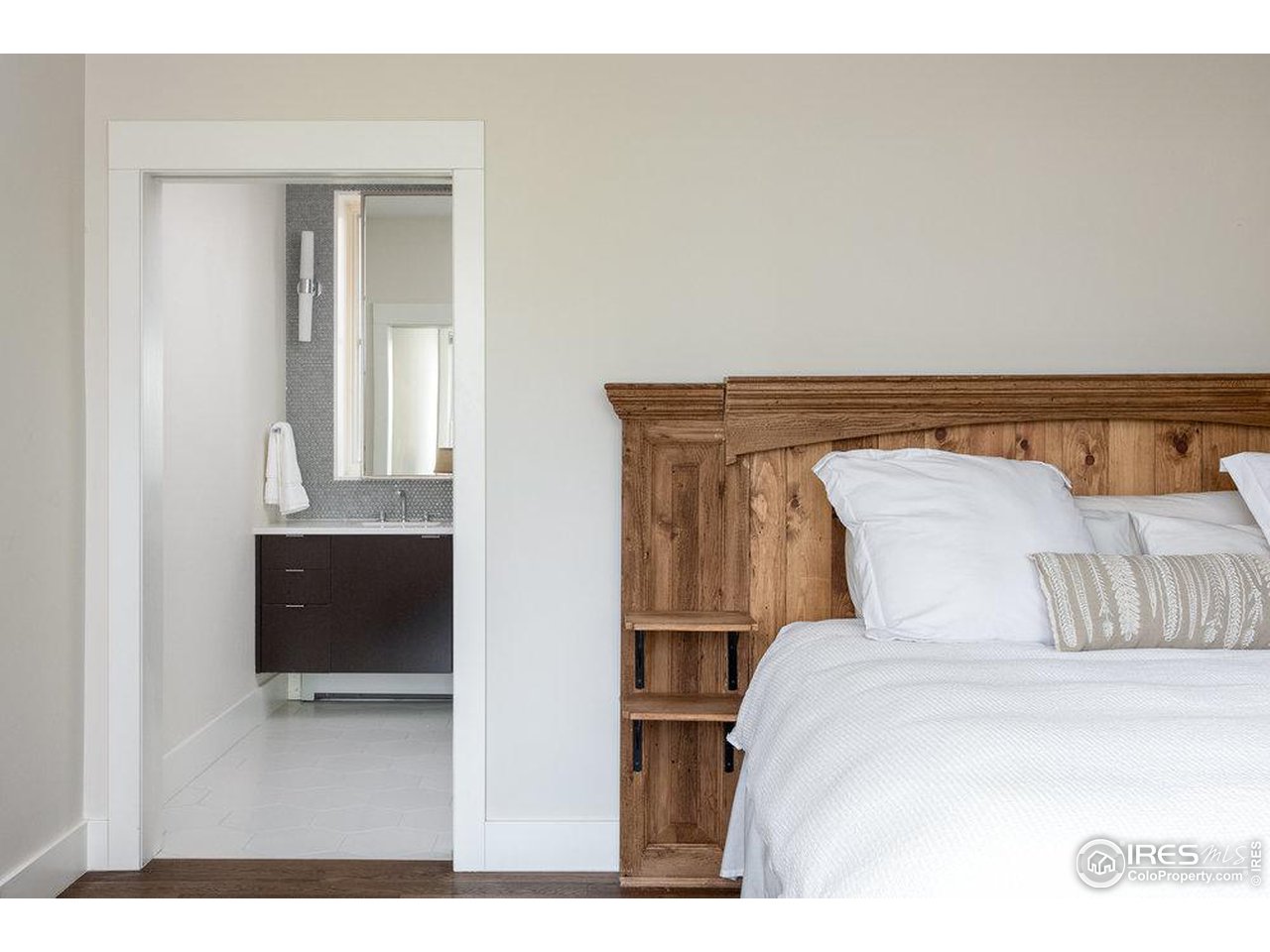 3221 8th Street Boulder, CO 80304 - Photo 19 of 40 a bedroom with a bed and a television