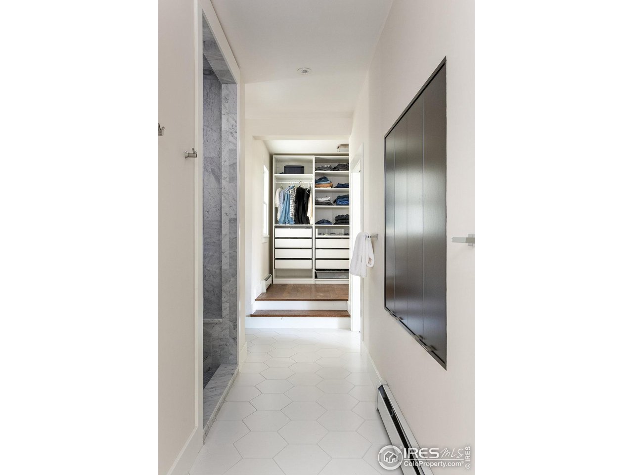 3221 8th Street Boulder, CO 80304 - Photo 21 of 40 a view of a hallway with wooden floor and staircase