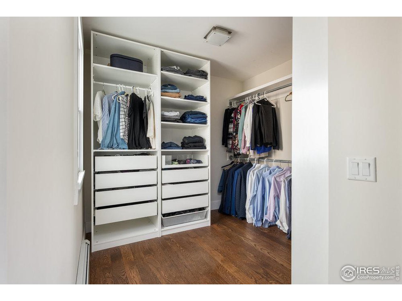 3221 8th Street Boulder, CO 80304 - Photo 24 of 40 a view of walk in closet with clothes and shoes