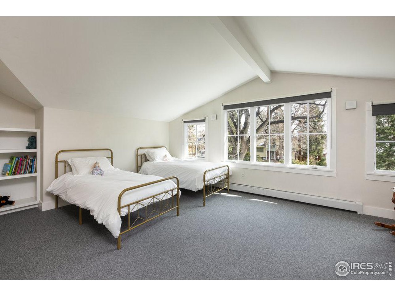 3221 8th Street Boulder, CO 80304 - Photo 27 of 40 a spacious bedroom with bed and large window