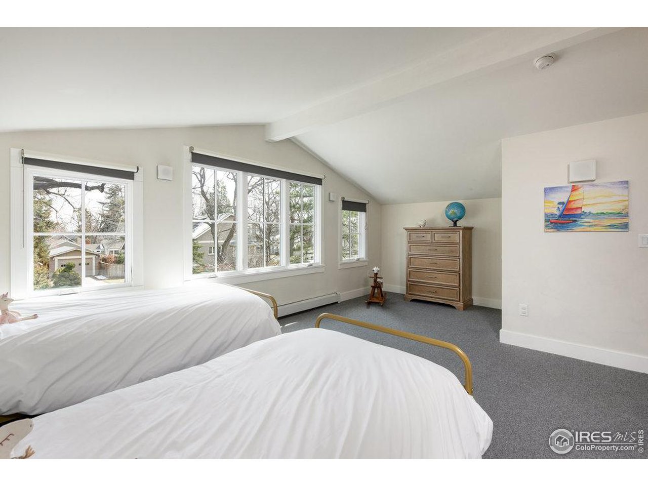 3221 8th Street Boulder, CO 80304 - Photo 28 of 40 a bedroom with two beds and a large window