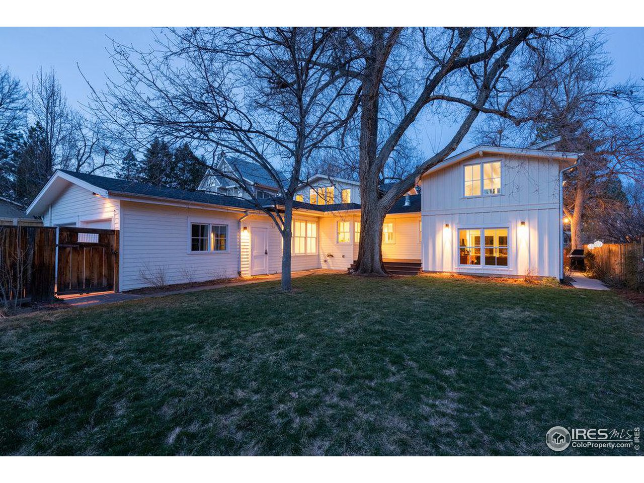 3221 8th Street Boulder, CO 80304 - Photo 35 of 40 a view of a yard in front of a house with large trees